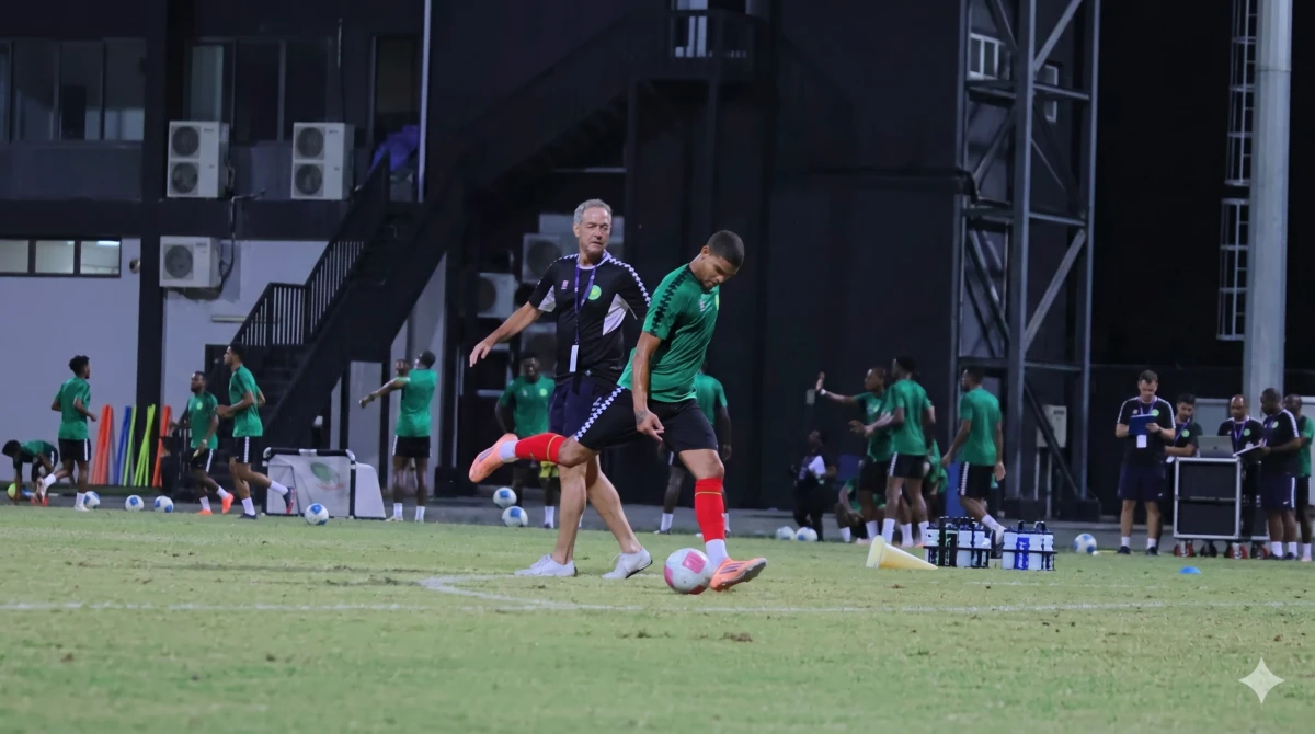 Thomas Dooley coaching a team at night.