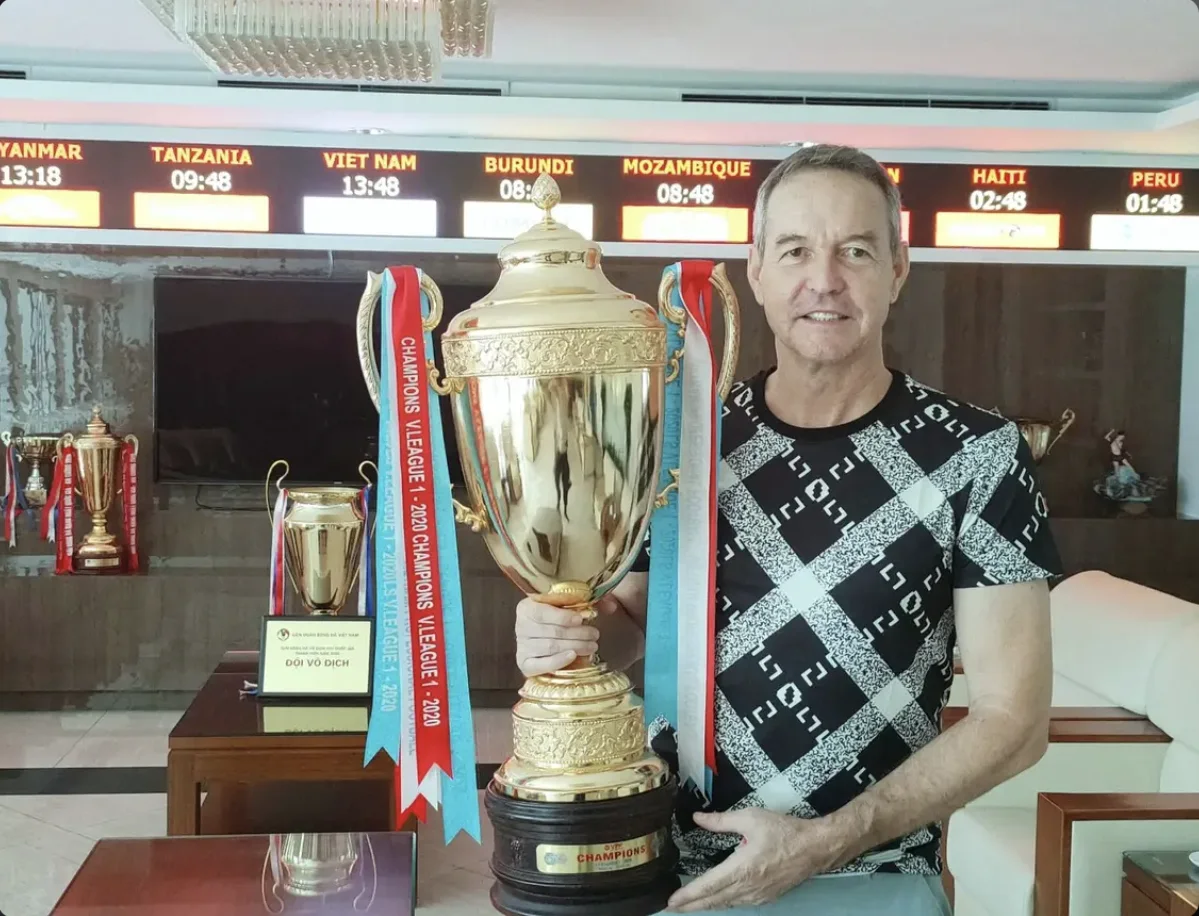 Thomas Dooley with the V.League I trophy as Vietnam national coaching staff.